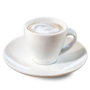 espresso macchiato in a white mug from Kaffee Partner