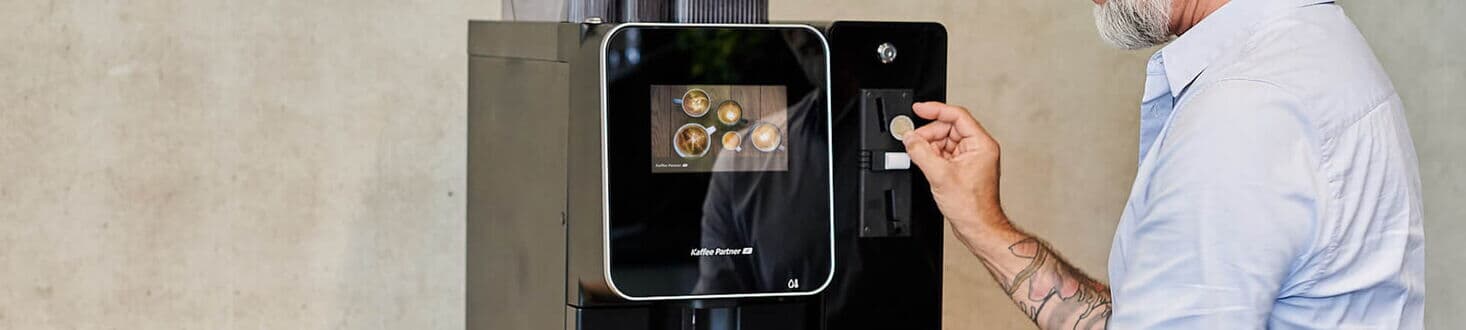 Paying with coins at the coffee machine