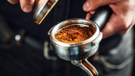 Tamper filled with coffee grounds